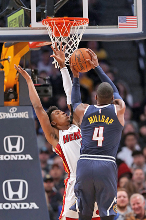 Paul Millsap of the Denver Nuggets puts up a shot against Josh Richardson (left) of the Miami Heat during their NBA game in Denver, Colorado, on Monday (AFP photo by Matthew Stockman)