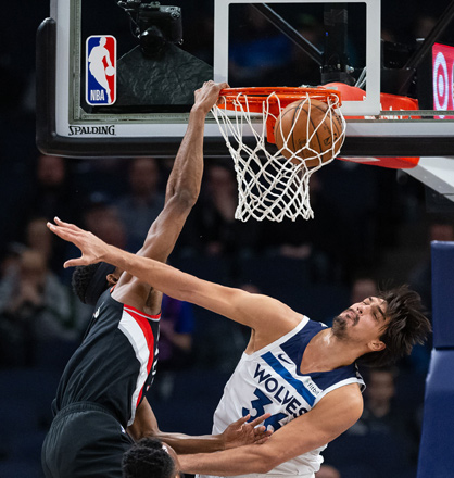 Portland Trail Blazers forward Maurice Harkless dunks the ball over Minnesota Timberwolves forward Dario Saric during their NBA game in Minneapolis, Minnesota, on Monday  (Reuters photo by Harrison Barden)