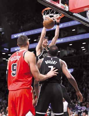 Yuta Watanabe of the Brooklyn Nets dunks the ball against the Chicago Bulls during their NBA game in New York City on Tuesday  (AFP photo by Dustin Satloff)
