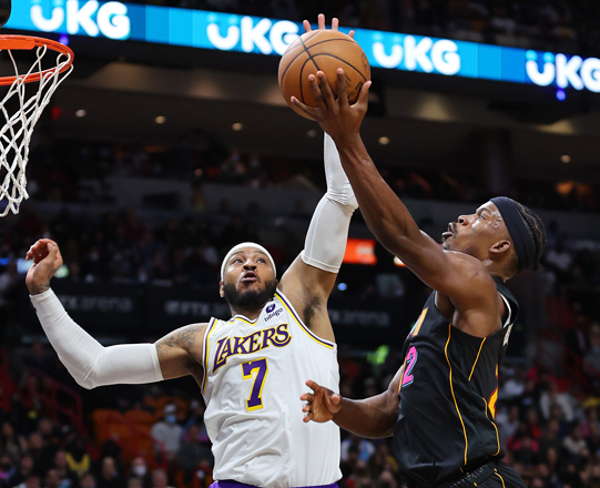 Jimmy Butler of the Miami Heat goes up for a layup against Carmelo Anthony of the Los Angeles Lakers during their NBA game in Miami, Florida, on Sunday  (AFP photo by Michael Reaves)