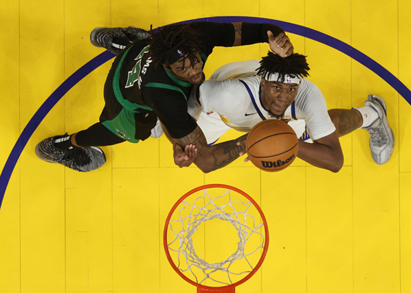 Golden State Warriors’ Kevon Looney and Boston Celtics’  Robert Williams III  (left) compete for the ball during Game Five of the 2022 NBA Finals in San Francisco, California, on Monday (AFP photo by Ezra Shaw)