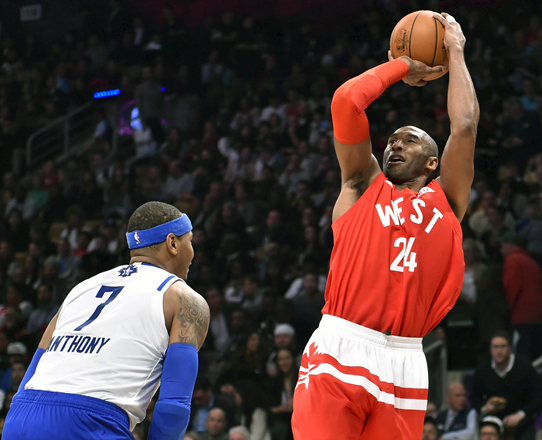 Western Conference forward Kobe Bryant of the Los Angeles Lakers shoots over Eastern Conference player Carmelo Anthony in their NBA All-Star Game in Toronto on Sunday (Reuters photo by Bob Donnan)