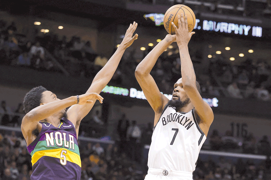 Kevin Durant of the Brooklyn Nets shoots over Herbert Jones of the New Orleans Pelicans during their NBA game in New Orleans, Louisiana, on Friday (AFP photo by Jonathan Bachman)