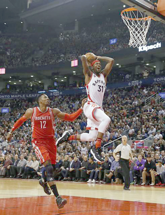 Toronto Raptors’ Terrence Ross goes for a dunk against Houston Rockets’ Dwight Howard during their NBA game in Toronto on Sunday (Photo courtesy of nba.com)