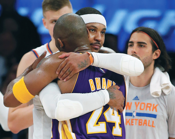 New York Knicks forward Carmelo Anthony embraces Los Angeles Lakers forward Kobe Bryant at the end of an NBA basketball game at Madison Square Garden in New York, on Sunday (AP photo by Kathy Willens)
