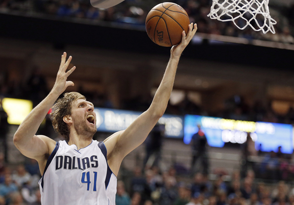 Dallas Mavericks forward Dirk Nowitzki attempts a lay-up during an NBA game against the Portland Trail Blazers in Dallas on Sunday (AP photo by Brandon Wade)
