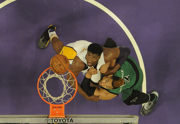 Los Angeles Lakers centre Roy Hibbert battles for rebounding position against Boston Celtics Jared Sullinger during their NBA game in Los Angeles on Sunday (Reuters photo by Richard Mackson)