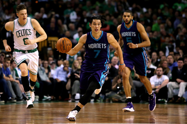 Jeremy Lin of the Charlotte Hornets brings the ball up court in an NBA game against the Boston Celtics in Boston on Monday (AFP photo by Mike Lawrie)