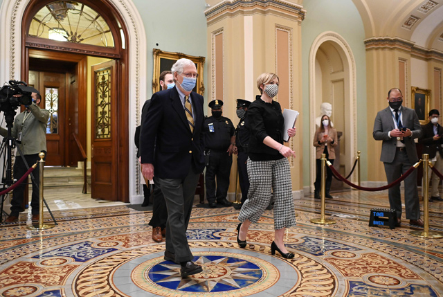 Republican Senate Minority Leader Mitch McConnell heads to his office during a quorum call after senators voted to hear witnesses during the second impeachment of former US president Donald Trump in the US Capitol in Washington, DC on Saturday (AFP photo)