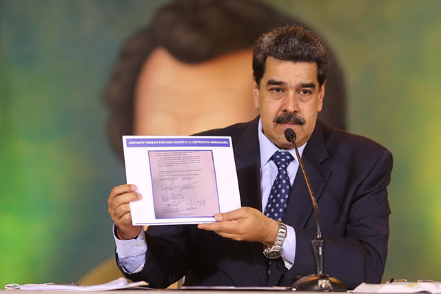 Venezuela's President Nicolas Maduro holds a document during a virtual news conference in Caracas, Venezuela May 6, 2020 (REUTERS photo)