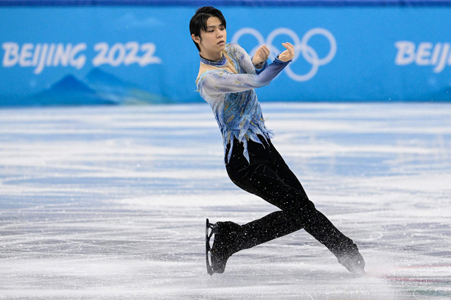 Japan’s Yuzuru Hanyu competes in the men’s single skating short programme of the figure skating event during the Beijing 2022 Winter Olympic Games in Beijing on Tuesday (AFP photo by Sebastien Bozon)