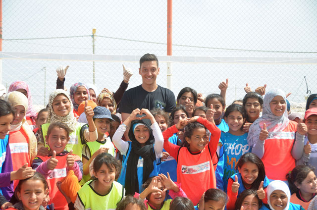 German football player Mesut Ozil join Syrian children at the Zaatari Refugee Camp in Mafraq on Wednesday (Photo by Muath Freij)