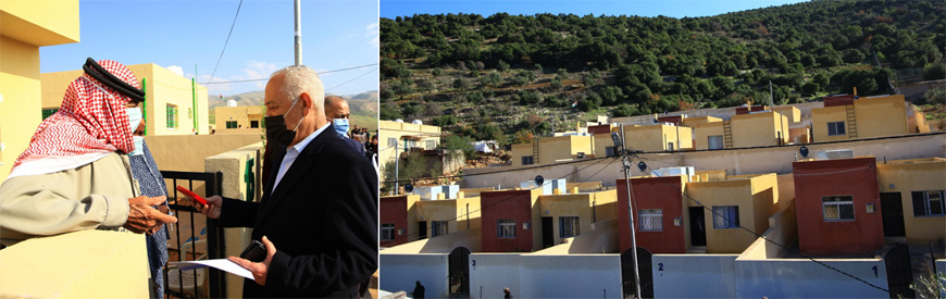 Royal Court Chief Yousef Issawi hands over the keys of a new house, built as part of a Royal Initiative, to a beneficiary on Saturday (Petra photos)