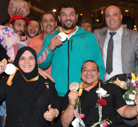  Jordan Paralympic silver medal powerlifters Tharwat Al Hajjaj (left) and Omar Qaradah (centre) and bronze medal powerlifter Jamil Al Shibli arrive at the Queen Alia International Airport on Thursday night (Photo courtesy of JOC News Service)