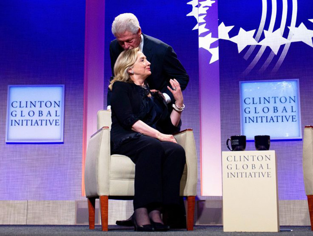  Former president Bill Clinton kisses his wife former secretary of state and presidential candidate Hillary Clinton at a Clinton Global Initiative function  (Photo courtesy of freebeacon.com)