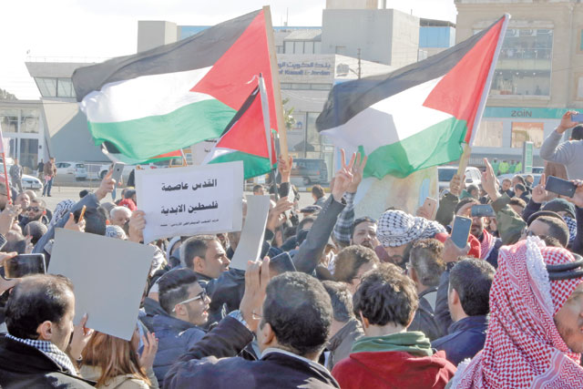 Jordanians protest the US decision on Jerusalem near the US embassy in Amman on Thursday (Photo by Osama Aqarbeh)