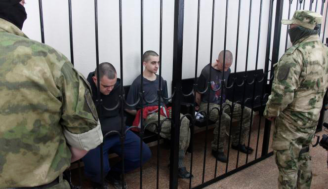 Pro-Russian rebels sentenced two British fighters and a third from Morocco to death on June 9 (AFP photo)