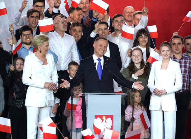 Polish President Andrzej Duda addresses supporters as exit poll results were announced during the presidential election in Pultusk, Poland, on Sunday (AFP photo)