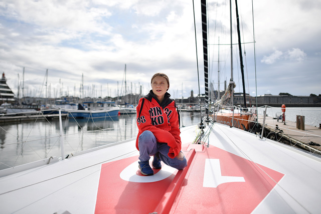 Swedish climate activist Greta Thunberg poses onboard the Malizia II sailing yacht in Plymouth, England, on Tuesday ahead of her journey across the Atlantic  (AFP photo by Ben Stansall)