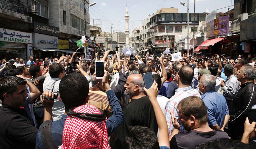 Protesters gather following Friday prayers to rally against the income tax bill and fuel and electricity price hikes near Hussein Mosque downtown Amman (Petra photo)