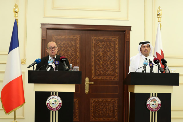 French Minister for Foreign and European Affairs Jean-Yves Le Drian (left) and Qatari Foreign Minister Sheikh Mohammed Bin Abdulrahman Al Thani hold a press conference after their meeting in Doha, Qatar, on Saturday (Anadolu Agency photo)