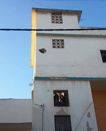 A photo shows damage to a building in Ramtha after a stray mortar shell fell on the northern edge of the city from fighting across the border in Syria, on Saturday   (Photo courtesy of www.alramtha.net)