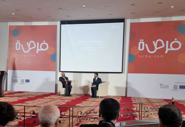 Minister of Education Omar Razzaz answers FORSA founder and CEO Sami Hourani during a Q&A session at the ‘Transforming Access to Education’ conference on Monday (Photo by Camille Dupire)