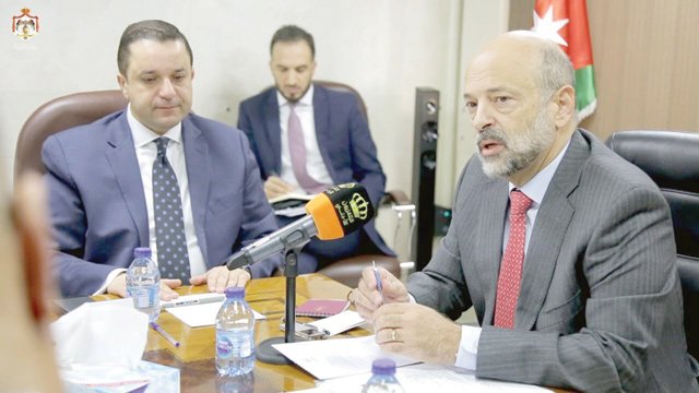 Prime Minister Omar Razzaz says 2020 budget law has no new taxes on citizens during a meeting at the Ministry of Finance on Tuesday (Petra photo)