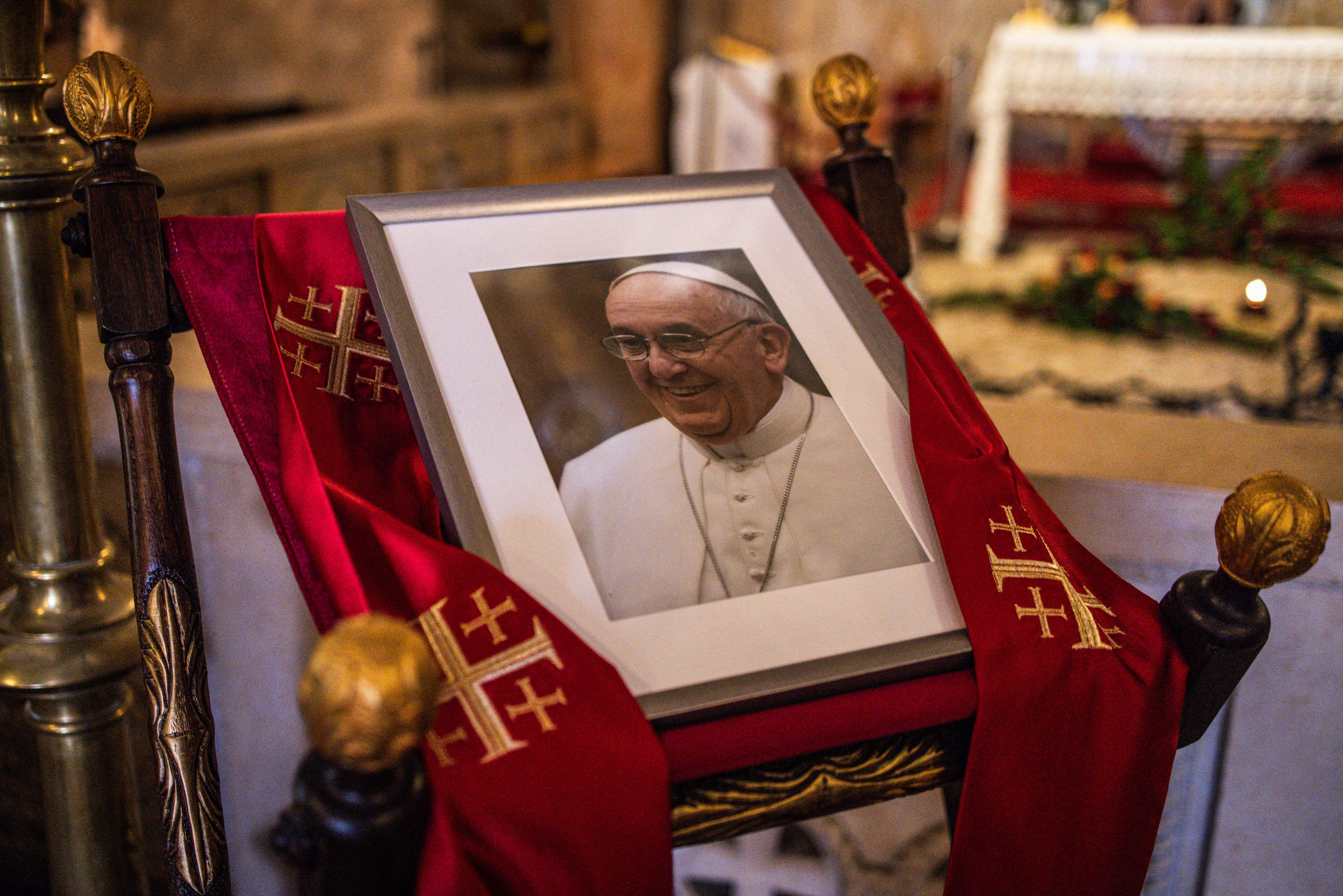 A portrait of late Pope Francis is displayed in the Franciscan Church in the Old City of Jerusalem on April 21, 2025 (AFP photo) 