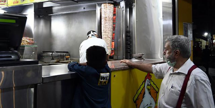 A customer waits for his order at a restaurant in Amman in this recent photo (Photo by Amjad Ghsoun)