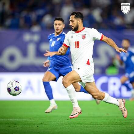 Jordan Mousa Tamari vies for the ball with Kuwaiti Eid Al Rashidi during a qualifying match played on Tuesday between Kuwait and Jordan at Jaber Al Ahmad International Stadium in Kuwait City (Photo courtesy of Jordan Football Association)