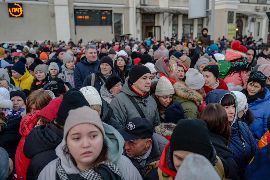 People gather on a platform to evacuate the city on Wednesday at the central train station of the major port city of Odessa which remains under Ukrainian control and has so far been spared fighting (AFP photo)