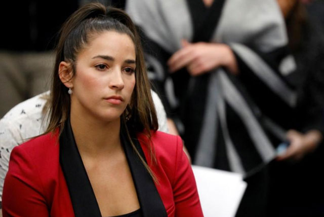 Victim and Olympic gold medalist Aly Raisman appears before speaking on January 19 in Lansing, Michigan, at the sentencing hearing for Larry Nassar, a former USA Gymnastics team doctor (Reuters photo by Brendan McDermid)