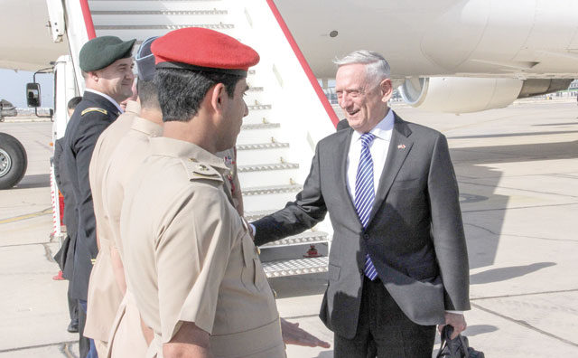 US Secretary for Defence Jim Mattis (right) shakes hands with Omani officials upon his arrival in the capital Muscat on Sunday (AFP photo)