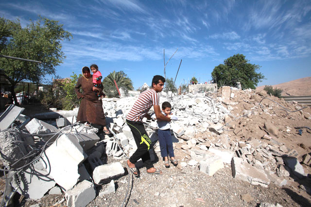 Palestinians stand over their house demolished  by Israeli soldiers at a farm in north of Jordan Valley in Tubas, West Bank, on Tuesday (Anadolu Agency photo)