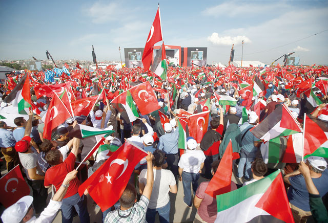 Demonstrators wave flags during a protest against the recent killings of Palestinian protesters on the Gaza-Israel border and the US embassy move to Jerusalem, in Istanbul, Turkey, on Friday (Reuters photo)