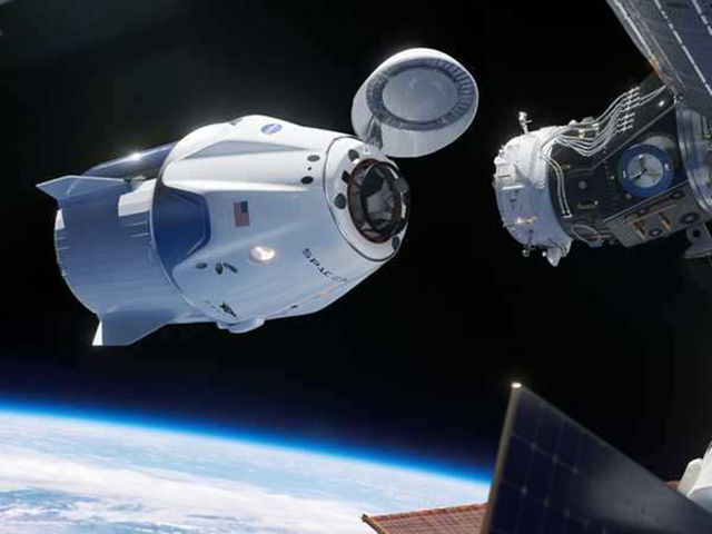 An illustration of SpaceX’s Crew Dragon vehicle, a spaceship designed to fly NASA astronauts, docking with the International Space Station (Photo courtesy of SpaceX)