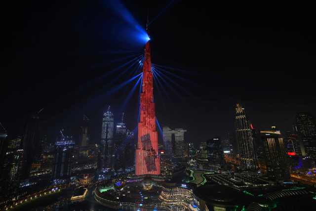 Dubai's Burj Khalifa is lit red on Tuesday as the UAE's 'Al Amal' — Arabic for 'Hope' — probe to Mars carries out a tricky manoeuvre to enter the Red Planet's orbit (AFP photo)