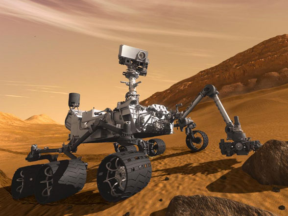 This artist’s concept features NASA’s Mars Science Laboratory Curiosity rover, a mobile robot for investigating Mars’ past or present ability to sustain microbial life (Photo courtesy of NASA) 