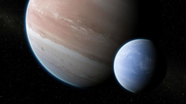 This illustration shows the exoplanet Kepler-1625b with a hypothesised moon  (Reuters photo)