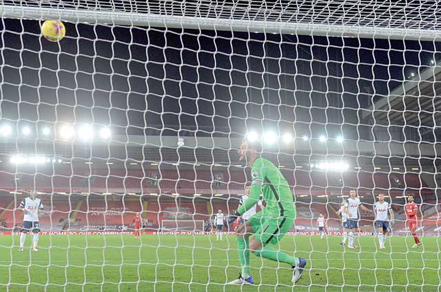 Liverpool’s Egyptian midfielder Mohamed Salah scores the opening goal past Tottenham Hotspur’s French goalkeeper Hugo Lloris during the English Premier League football match between Liverpool and Tottenham Hotspur at Anfield in Liverpool, northwest England, on Wednesday (AFP photo)