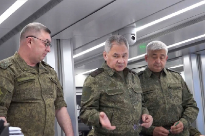 This screengrab made from undated video footage released by the Russian defence ministry on Monday show Russia's Defence Minister Sergei Shoigu (centre) gesturing between officers as they look at a map in an undisclosed location (AFP photo)