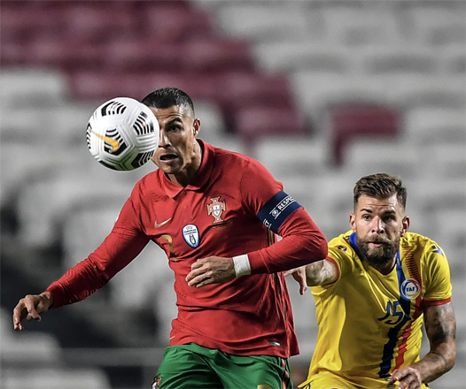 Portugal’s forward Cristiano Ronaldo (left) vies with Andorra’s midfielder Moises San Nicolas during their international friendly match in Lisbon on Wednesday (AFP photo by Patricia de Melo Moreira)