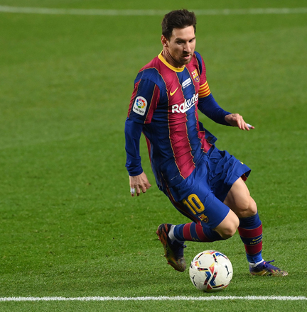 Barcelona’s Argentinian forward Lionel Messi controls the ball against Valencia CF during their Spanish league match in Barcelona on Saturday (AFP photo by Lluis Gene)