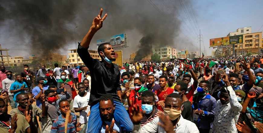 Sudanese demonstrators gesture as they chant during a protest on Sixty street in the east of the capital Khartoum on Tuesday (AFP photo)