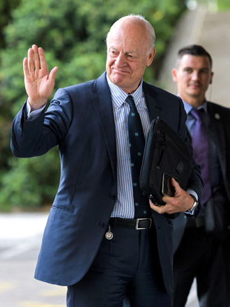 UN Special Envoy for Syria Staffan de Mistura gestures upon arrival to attend  peace talks on Monday at the United Nations Offices in Geneva (AFP photo)