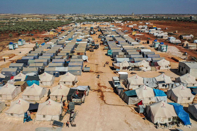 This photo taken on July 9 shows an aerial view of tents at the Azraq camp for displaced Syrians near the town of Maaret Misrin in Syria's northwestern Idlib province, sheltering several hundred families displaced by conflict from the northern Hama and southern and eastern Idlib countrysides (AFP photo)