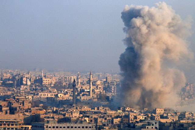 Smoke rises as seen from a governement-held area of Aleppo, Syria, on Monday (Reuters photo)