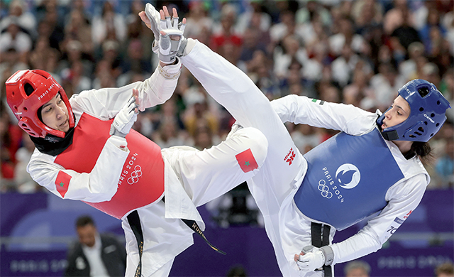 Morocco’s Fatima-Ezzahra Aboufaras (left) competes against Jordan’s Rama Abo-Alrub in the taekwondo women’s +67kg round of 16 bout of the Paris 2024 Olympic Games at the Grand Palais in Paris on Saturday (AFP photo)