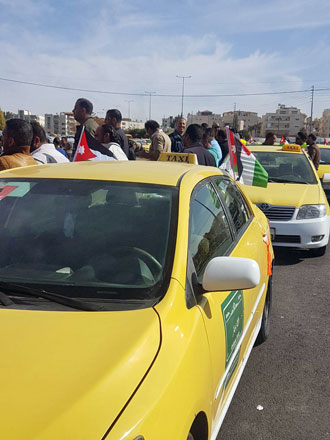 In this undated photo, taxi drivers prepare to protest Uber and Careem, which they say is eating into their profits  (Photo by Osama Aqarbeh)